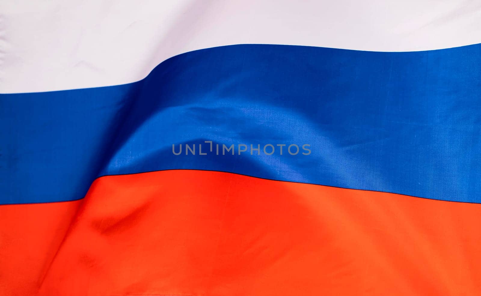 Waving colorful national flag of russia. Russian-Ukrainian conflict concept
