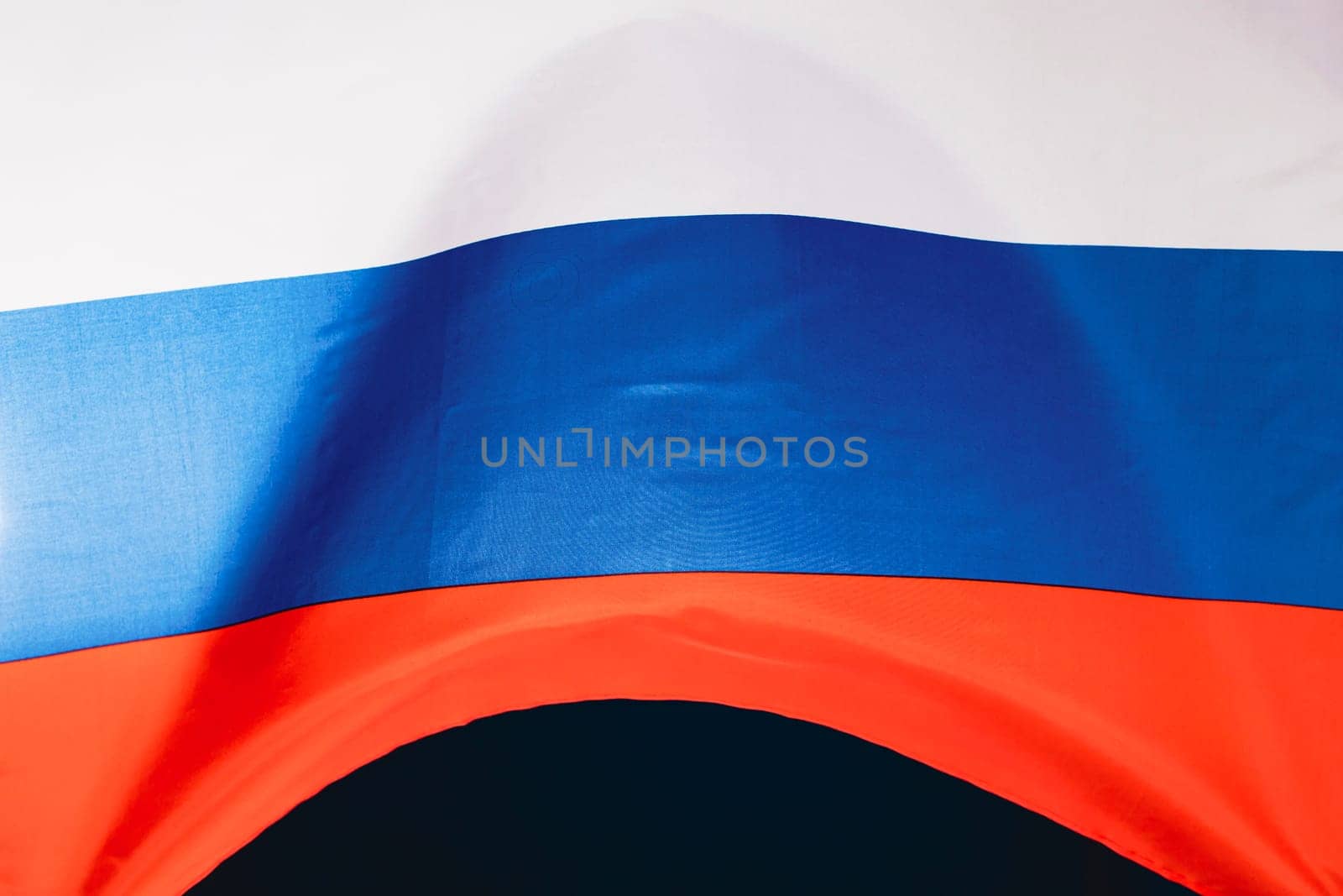 Waving colorful national flag of russia. Russian-Ukrainian conflict concept