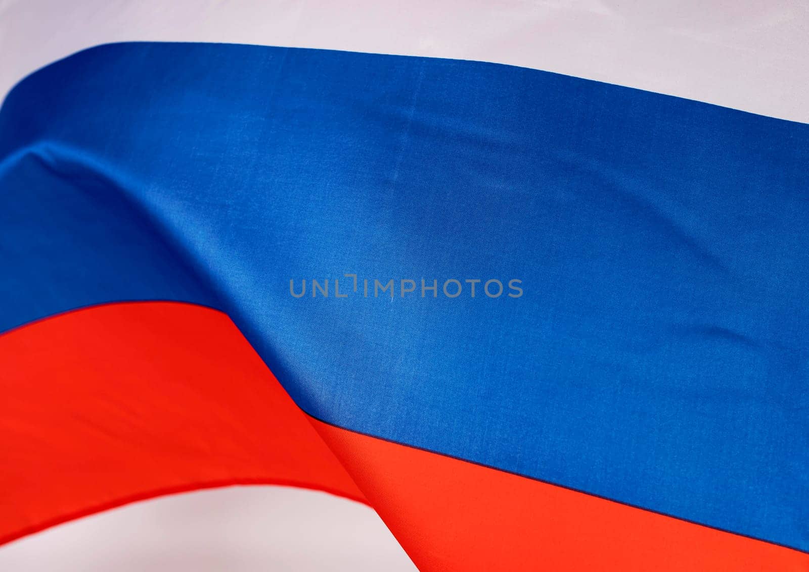 Waving colorful national flag of russia. Russian-Ukrainian conflict concept