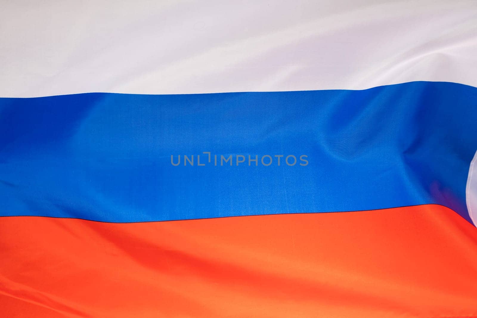 Waving colorful national flag of russia. Russian-Ukrainian conflict concept