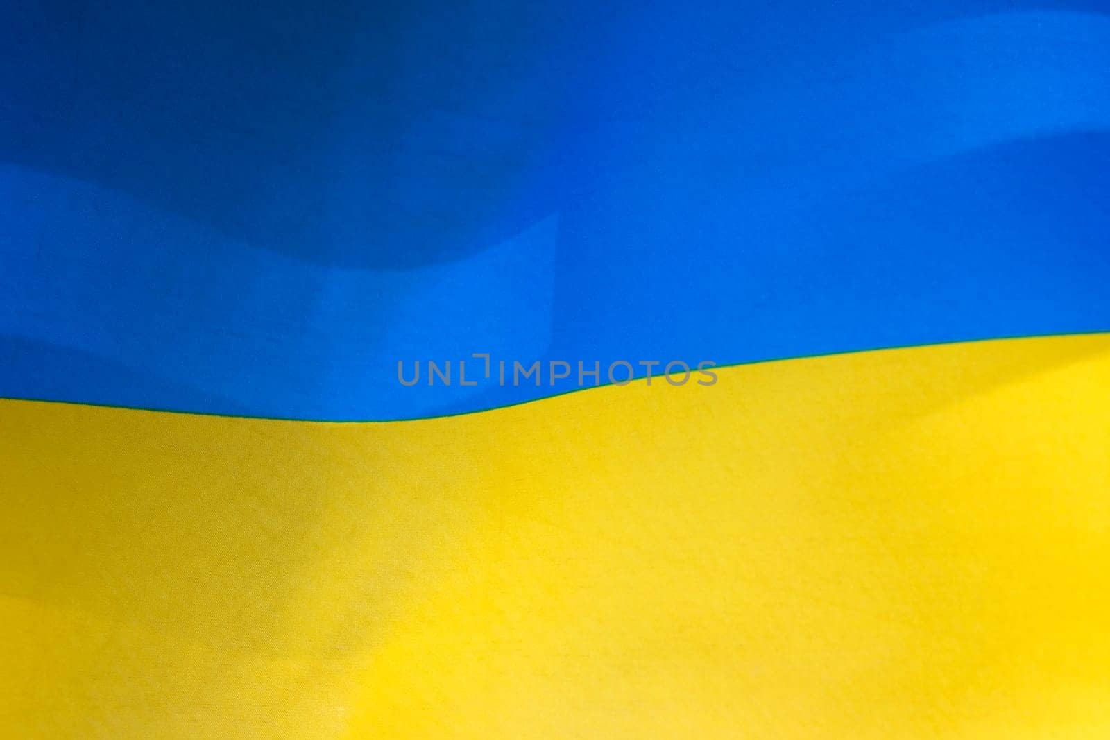 Flag of Ukraine, UA. Blue and yellow colors. Close up shot, background