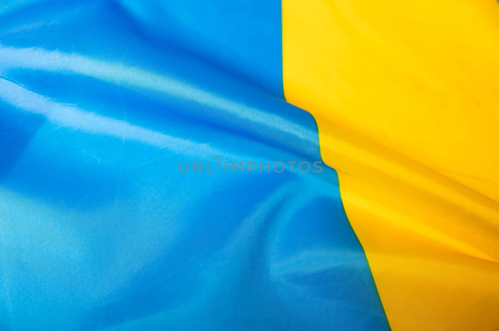 Flag of Ukraine. Blue and yellow colors. Close up shot, background