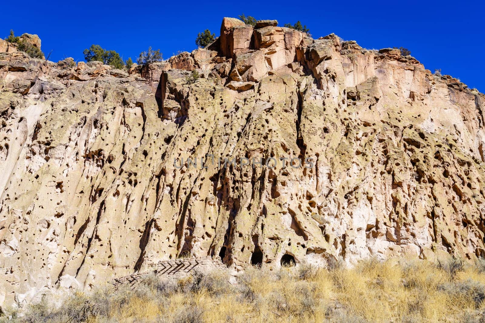A view of the main cliff of Bandelier National Monument showing cave dwellings