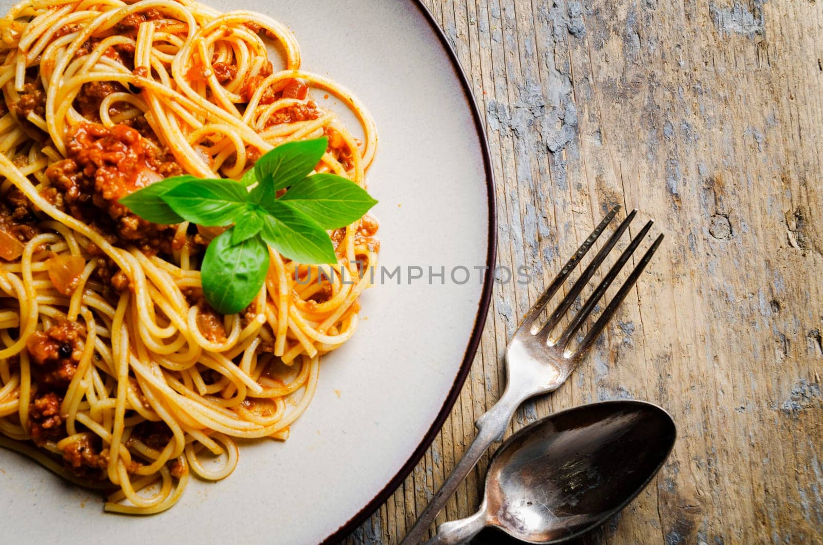Italian spaghetti on rustic wooden table