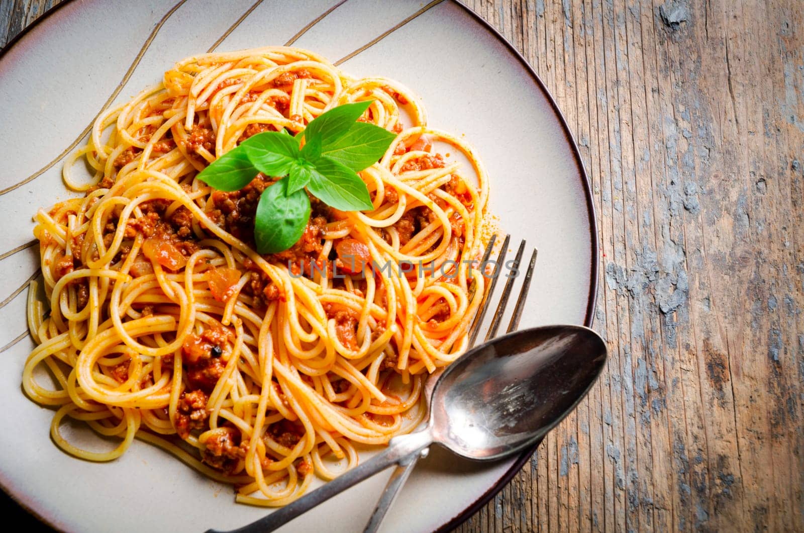 Italian spaghetti on rustic wooden table
