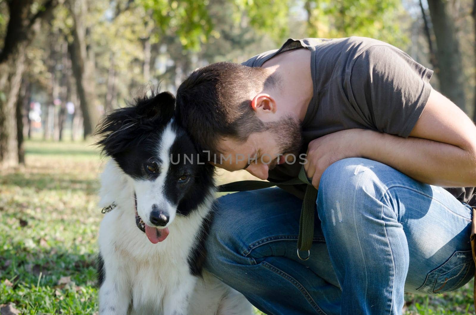 Man with his dog playing in the park