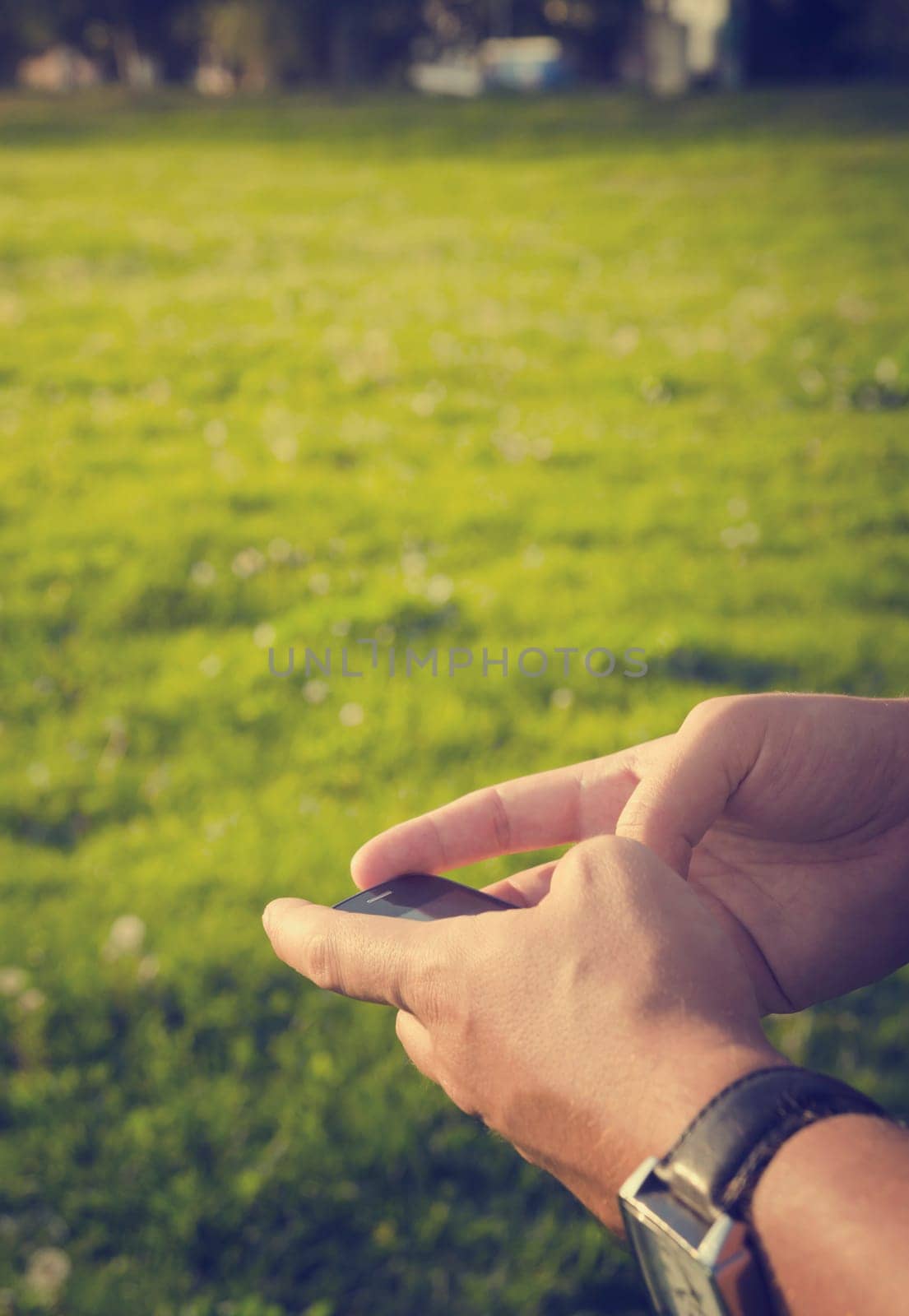 Man holding smartphone. Retro style image.