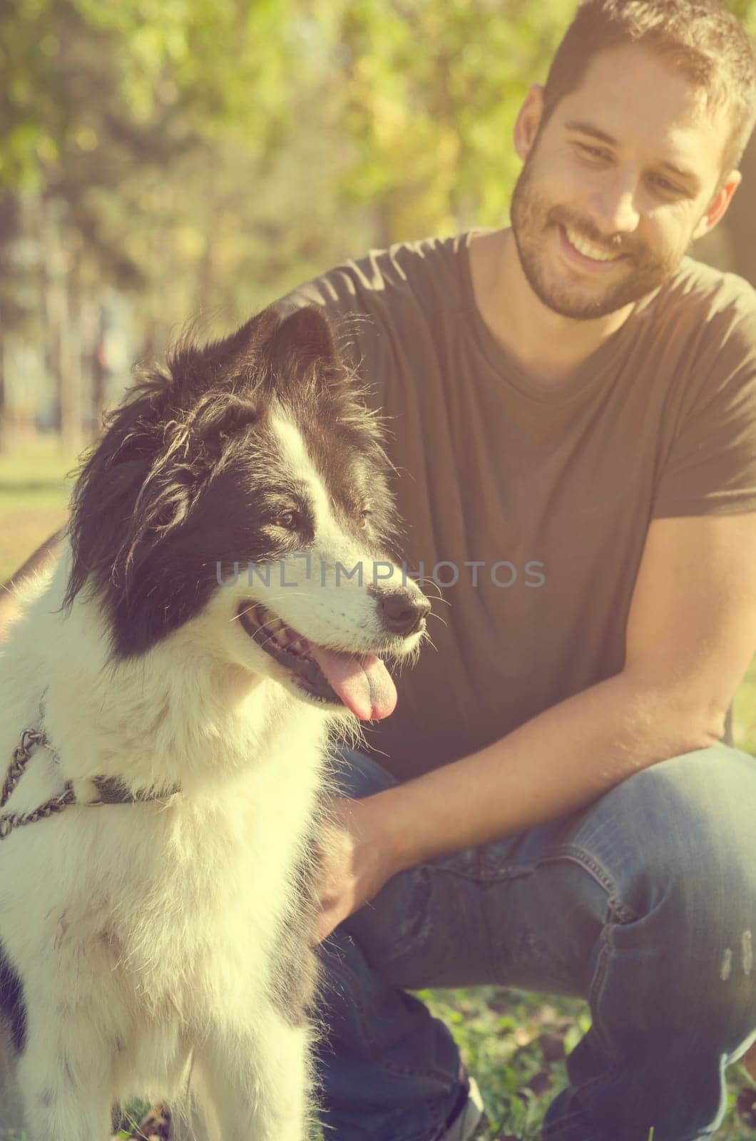 Man with his dog playing in the park