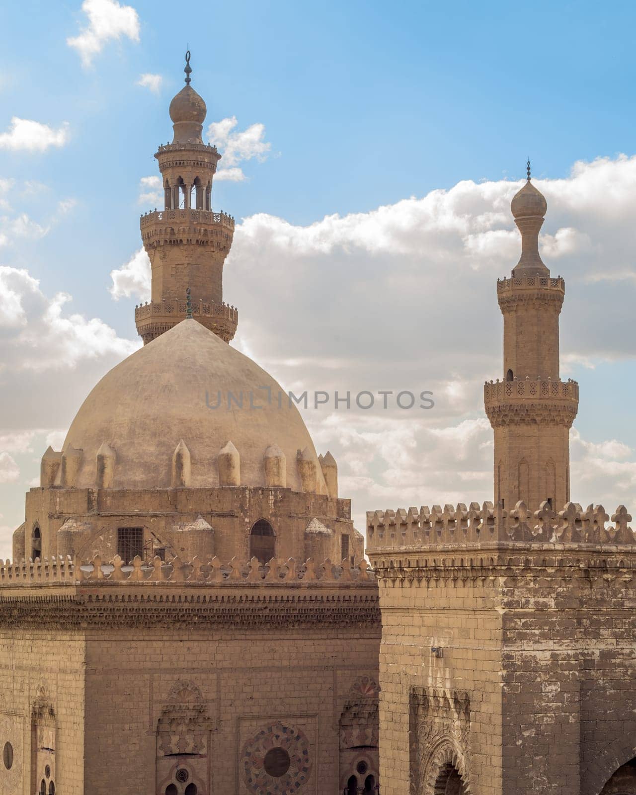 The Minarets and domes of Sultan Hassan Mosque and Al Rifai Mosque, Cairo, Egypt on a cloudy sky background