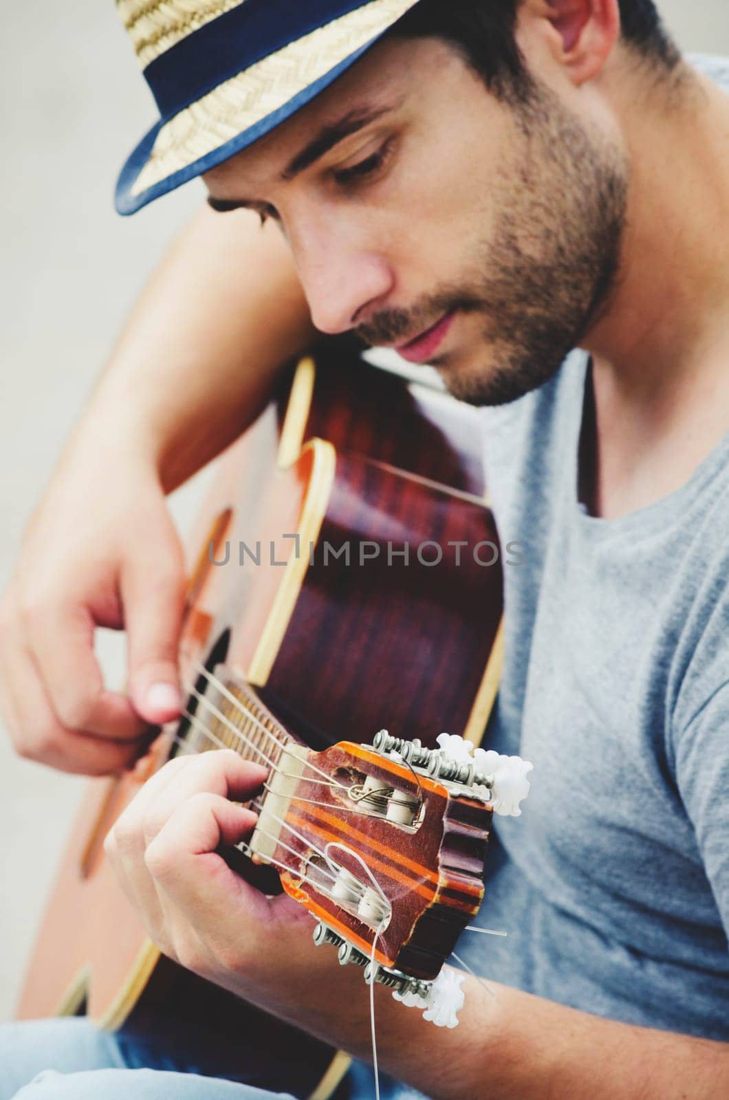 man plays the guitar on the street. retro style.