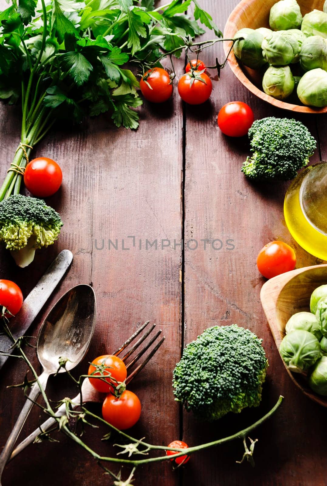 Food ingredients arranged on wooden table with copyspace