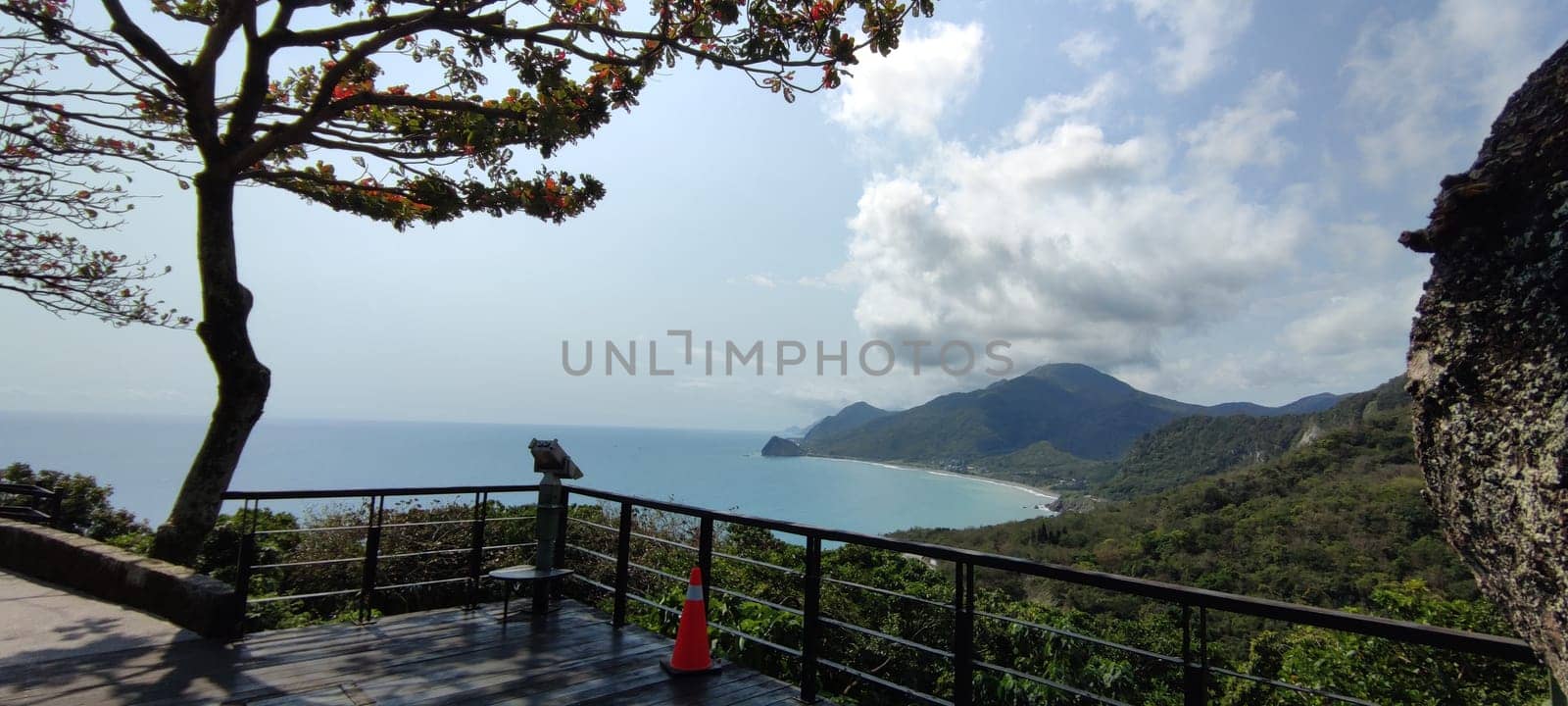 Hualien ocean of Taiwan. China. Beautiful blue sea with lush mountain and granite pebble beach