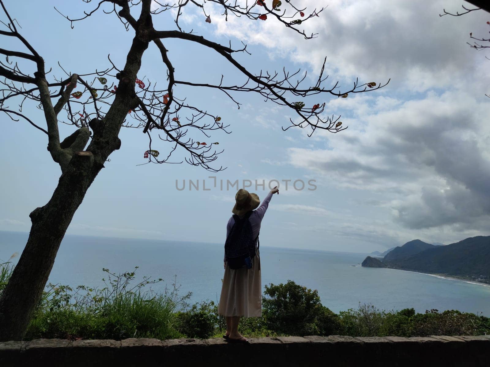 Hualien ocean of Taiwan. China. Beautiful blue sea with lush mountain and granite pebble beach
