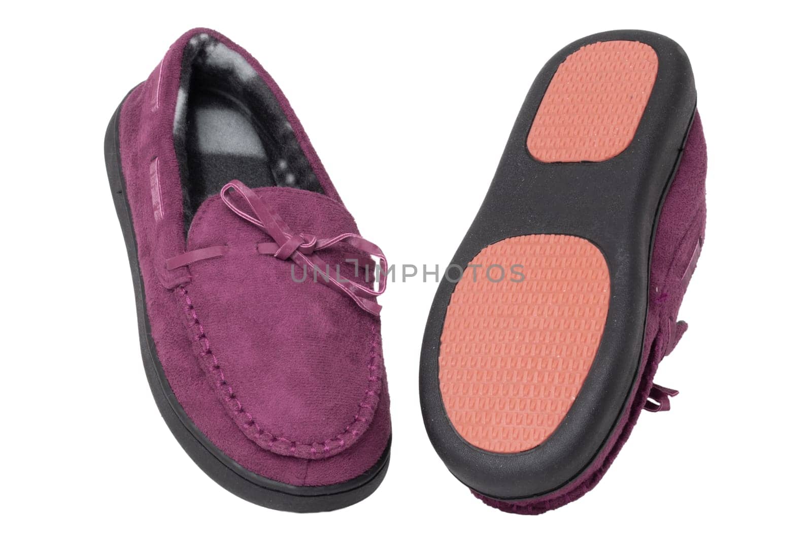 Slippers isolated. Close-up of a pair of female violet warm and soft cosy terry slippers with non-slip sole isolated on white background.  Shoes of a woman. Macro.
