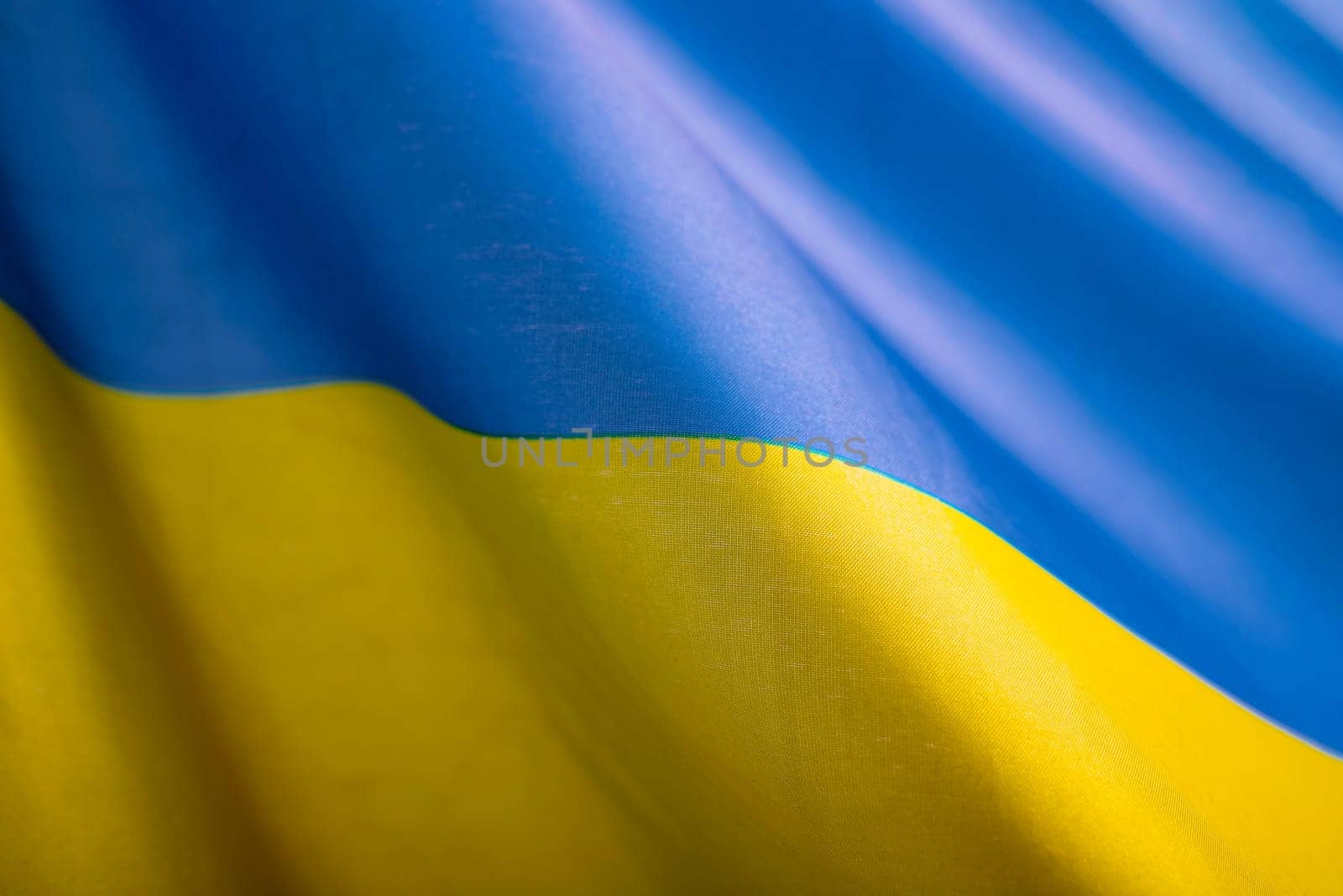 Flag of Ukraine. Blue and yellow colors. Close up shot, background