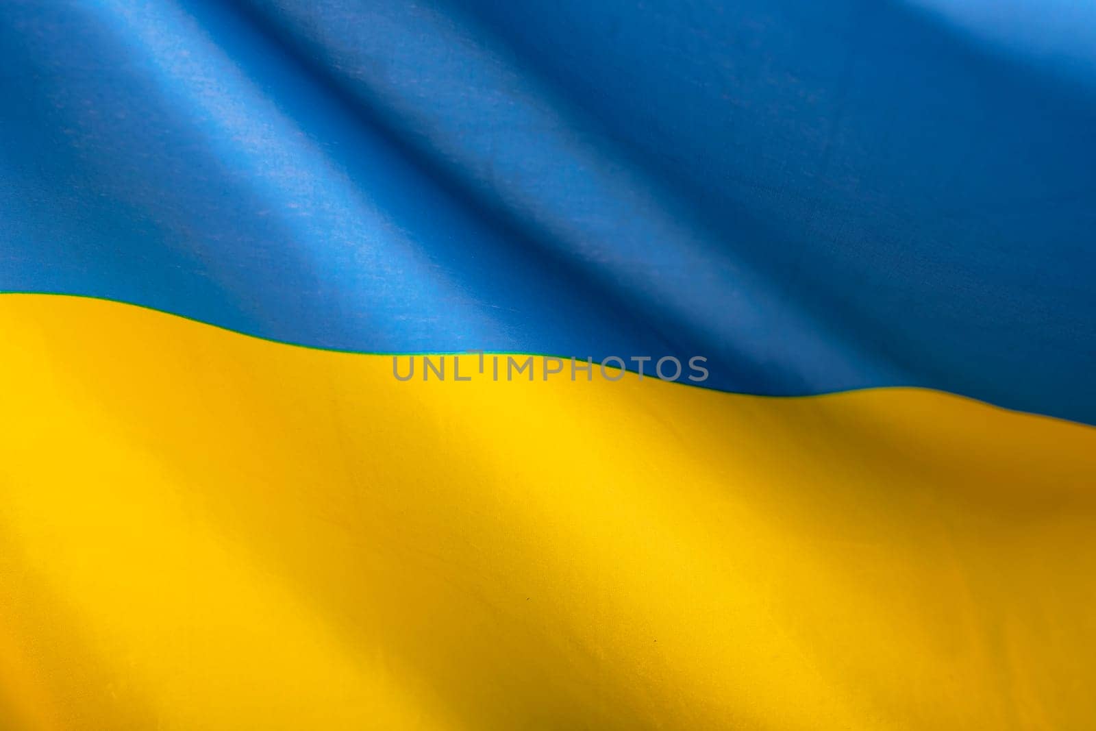 Flag of Ukraine. Blue and yellow colors. Close up shot, background