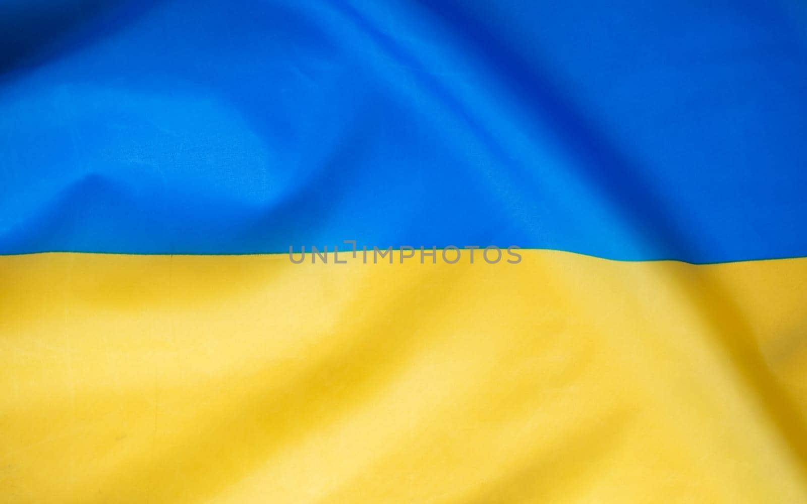 Flag of Ukraine, UA. Blue and yellow colors. Close up shot, background