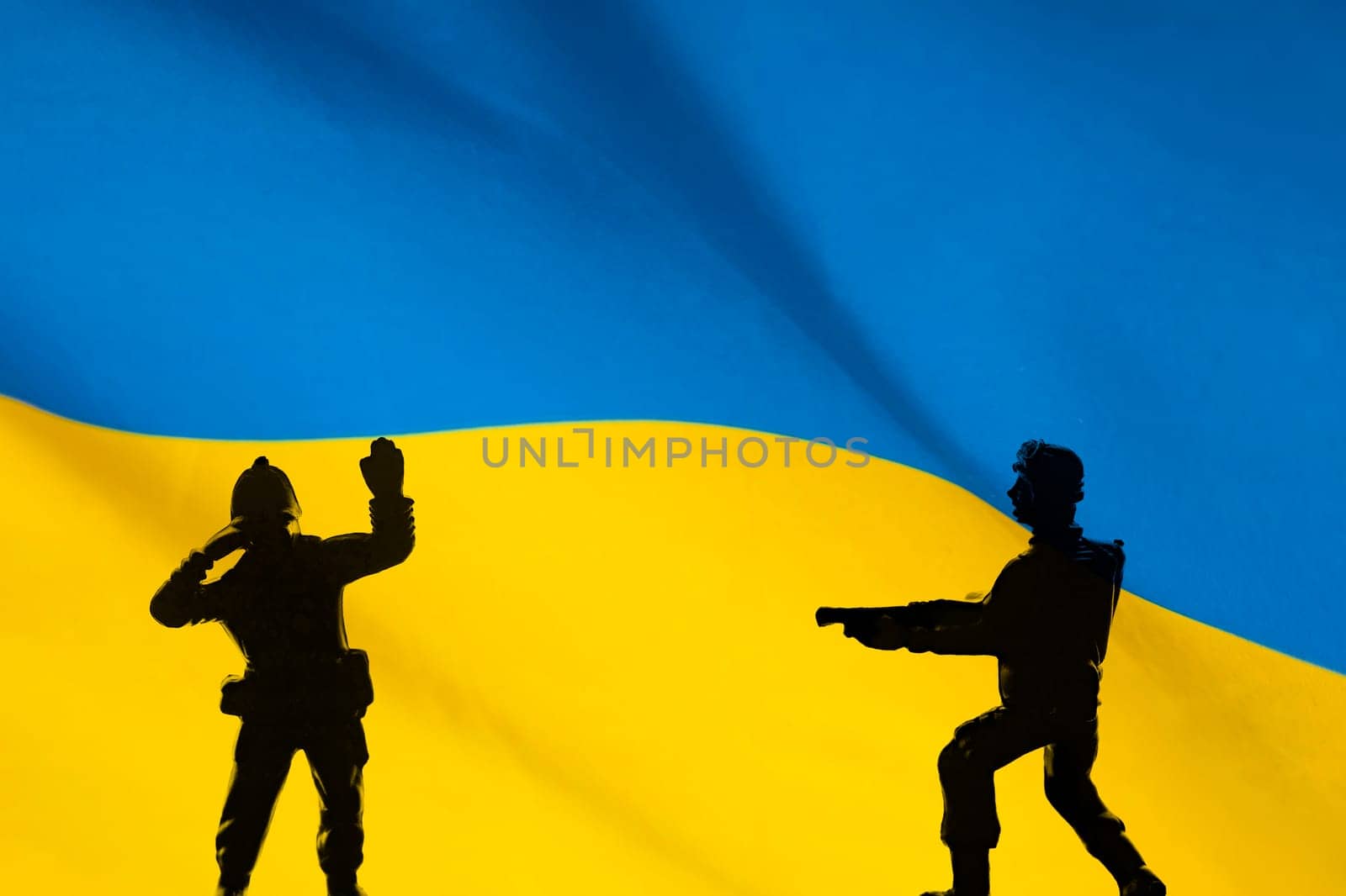 Flag of Ukraine with soldiers shadows. Russian-Ukrainian crisis, conflict.