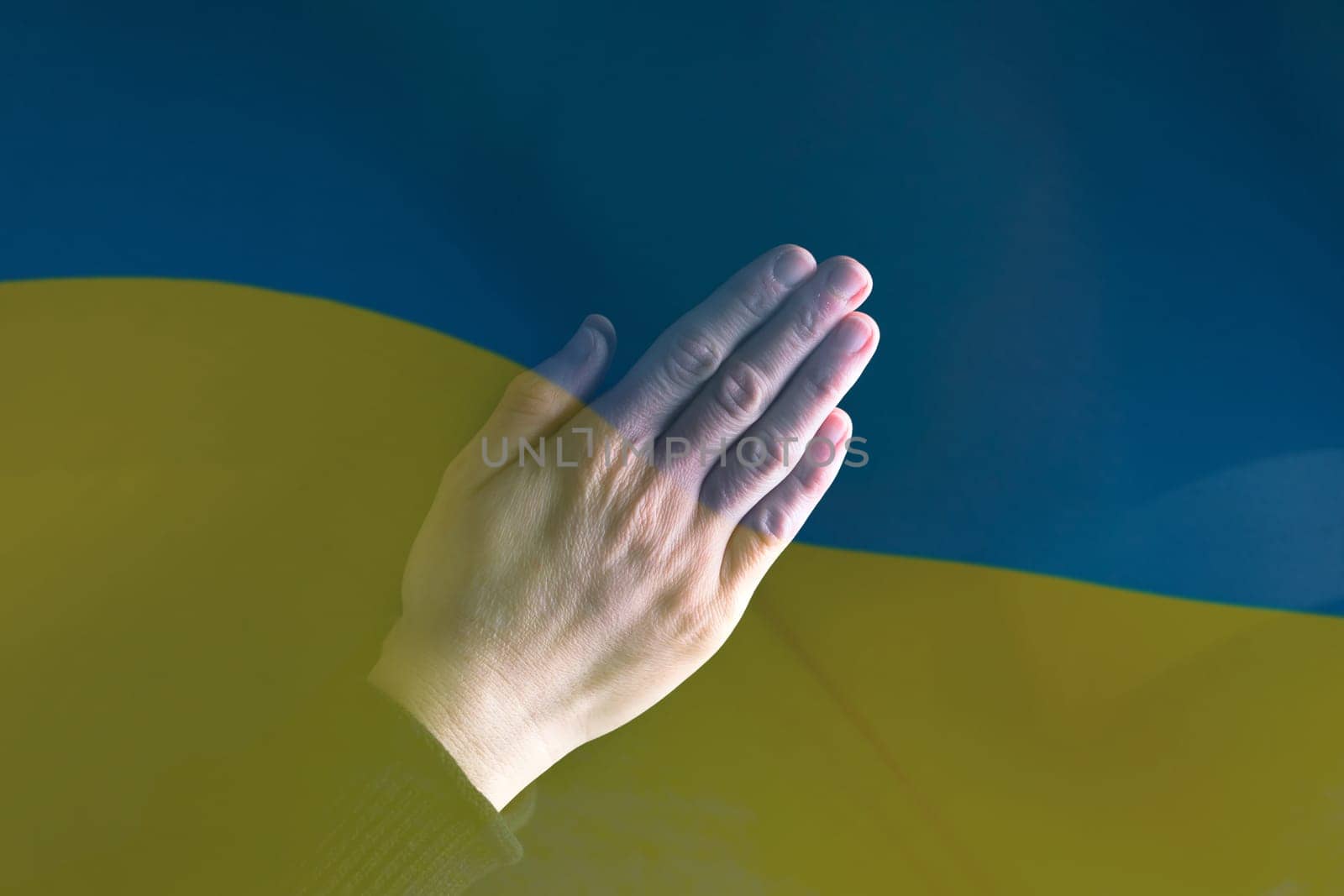 Pray for Ukraine concept background. National Ukrainian flag. Concept symbol of help support and no war in the country of Ukraine.