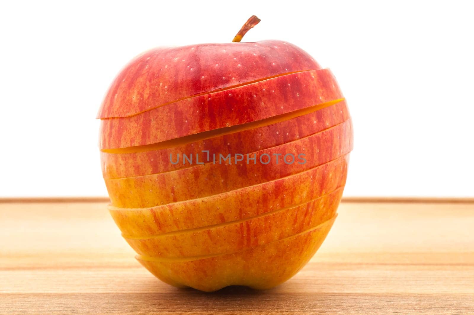 Close-up A delicious juicy apple for baking cut across on a table.