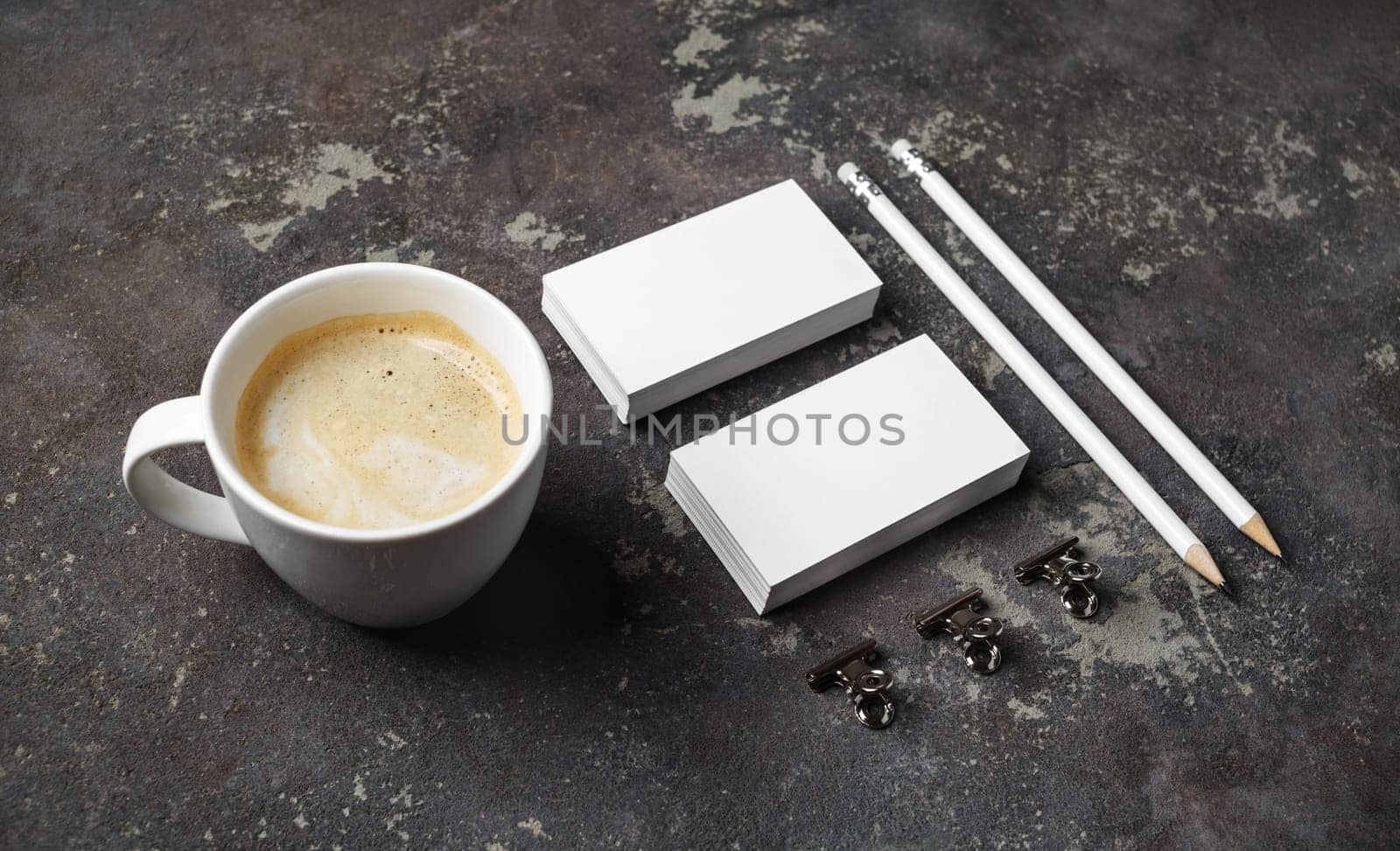 Corporate identity template on concrete background. Photo of blank stationery set and coffee cup.