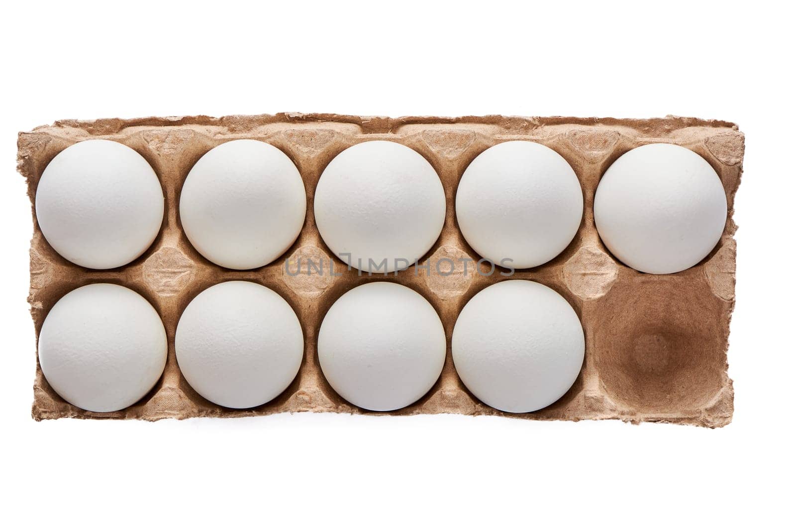 Nine white eggs on a cardboard stand on a white isolated background. High quality photo