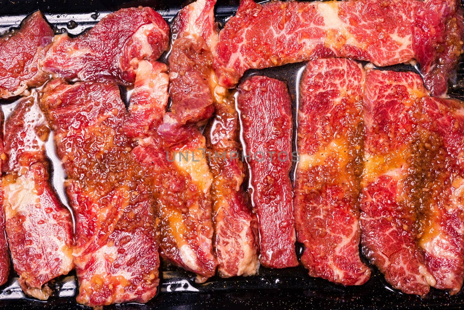 Raw pork on plate, Korean traditional style fresh pork beef belly BBQ, Japanese meat hot pot or Shabu in the restaurant, barbecue food