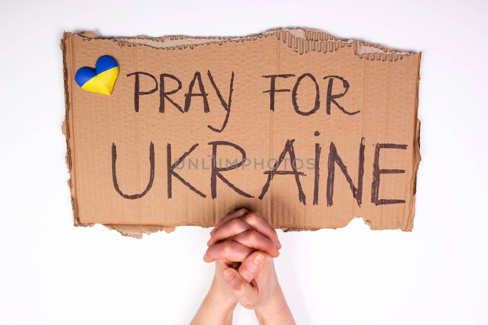 Pray for Ukraine concept background. Concept symbol of help support and no war in the country of Ukraine.