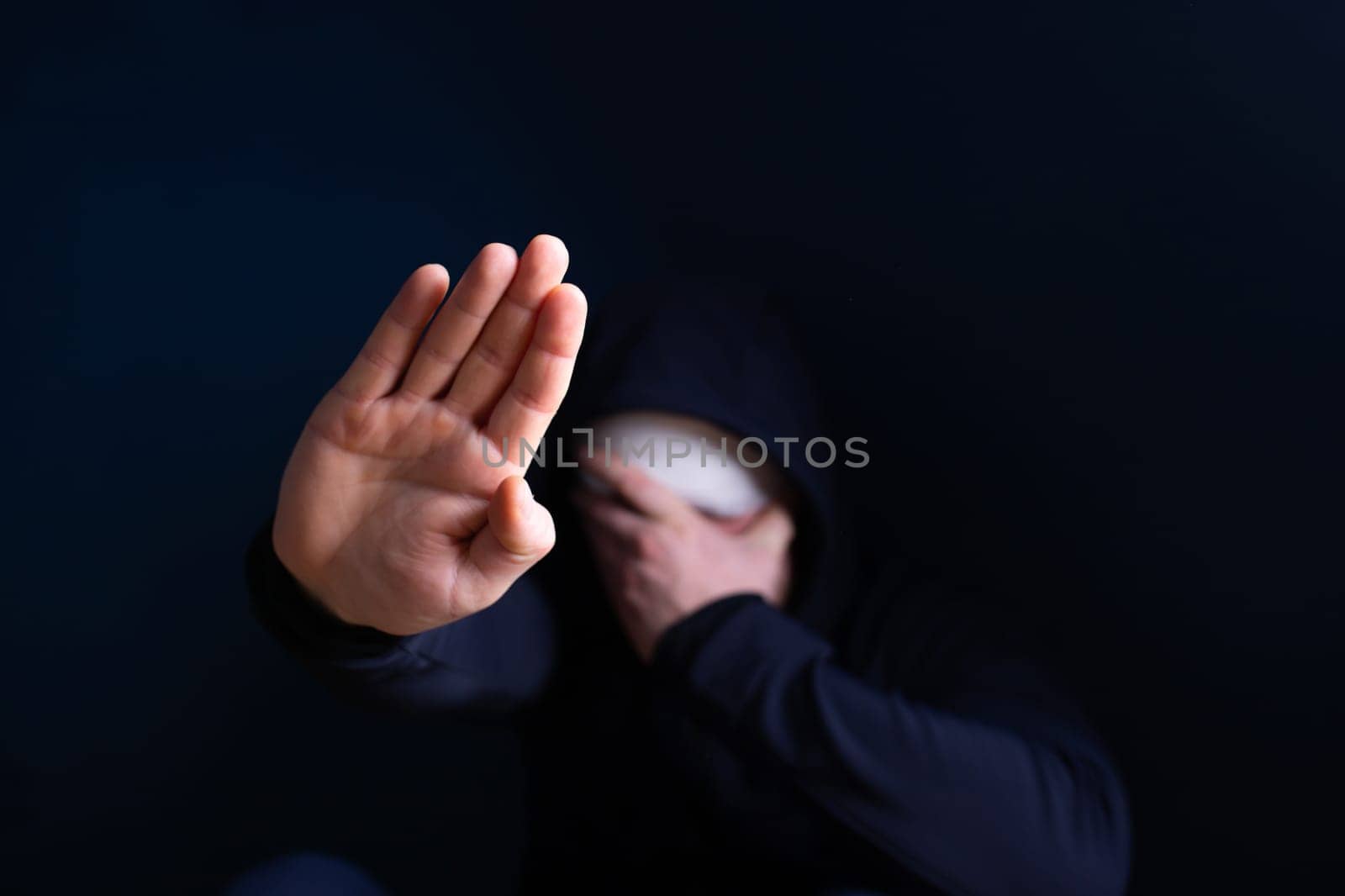 Wounded man showing stop gesture. Stop war, russian aggression, freedom to Ukraine concept.