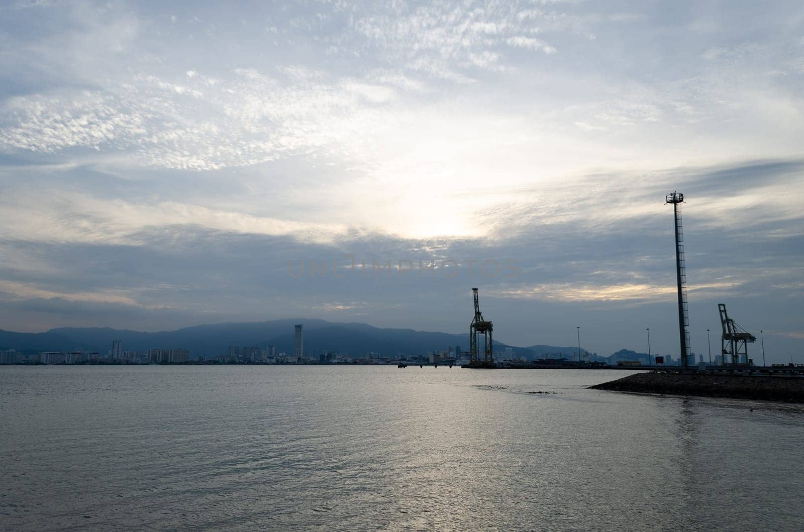 Container terminal port in evening. Background is Penang Island