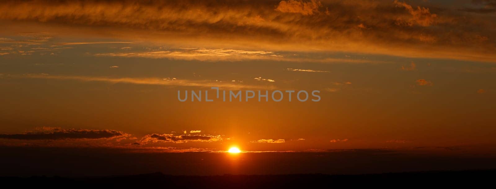 sky with late yellow sunset with clouds