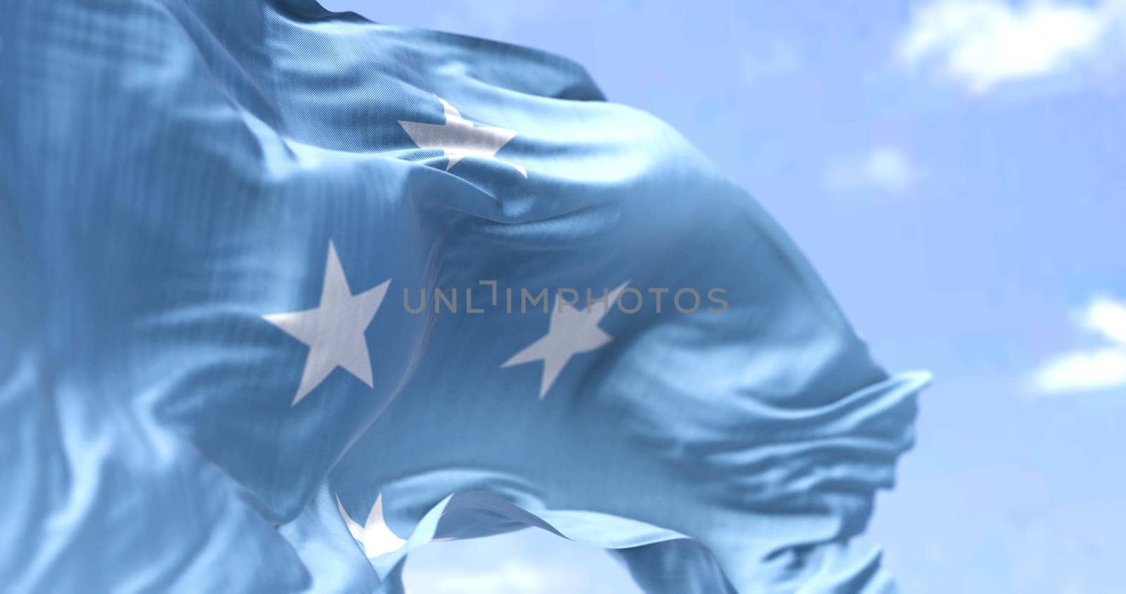 Detail of the national flag of Micronesia waving in the wind on a clear day. Micronesia is an island country in Oceania. Selective focus.
