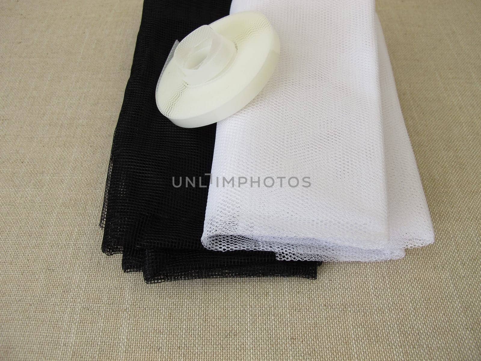 Insect screens for the window in white and anthracite and fixing tape