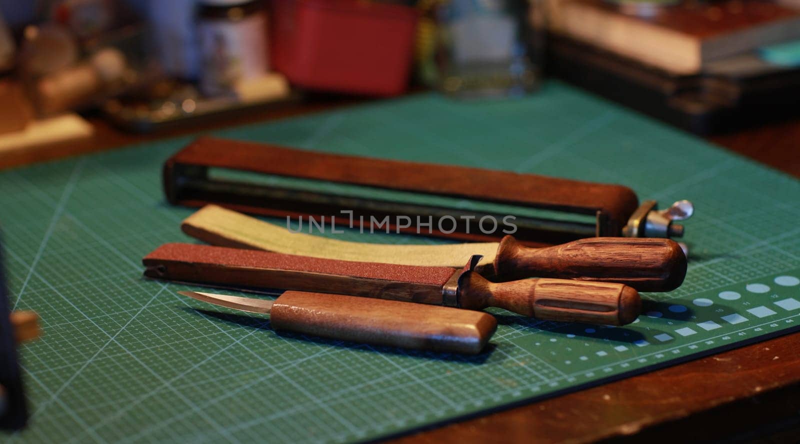 wood cutter and a manual sharpening tool on a table