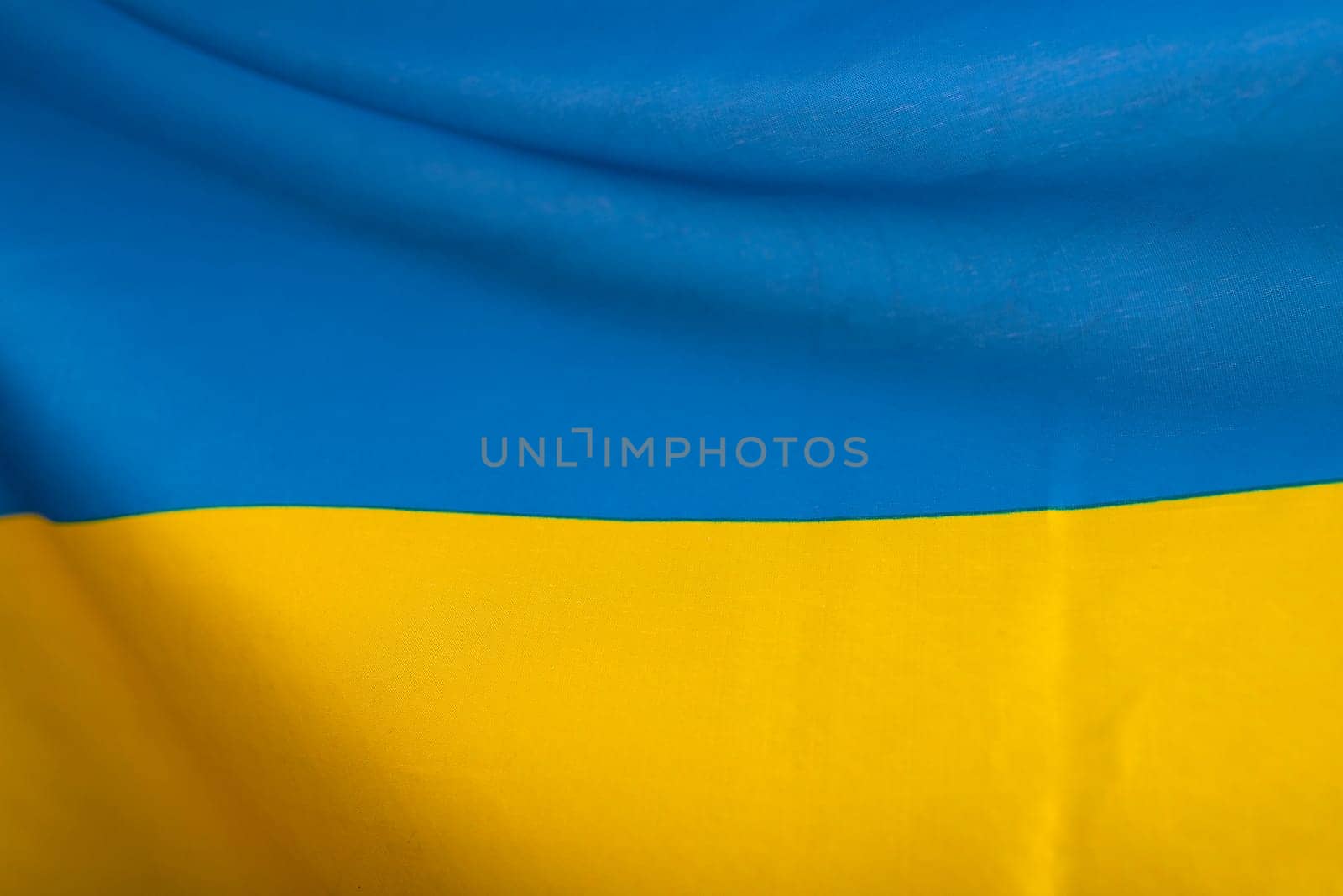 Flag of Ukraine. Blue and yellow colors. Close up shot, background