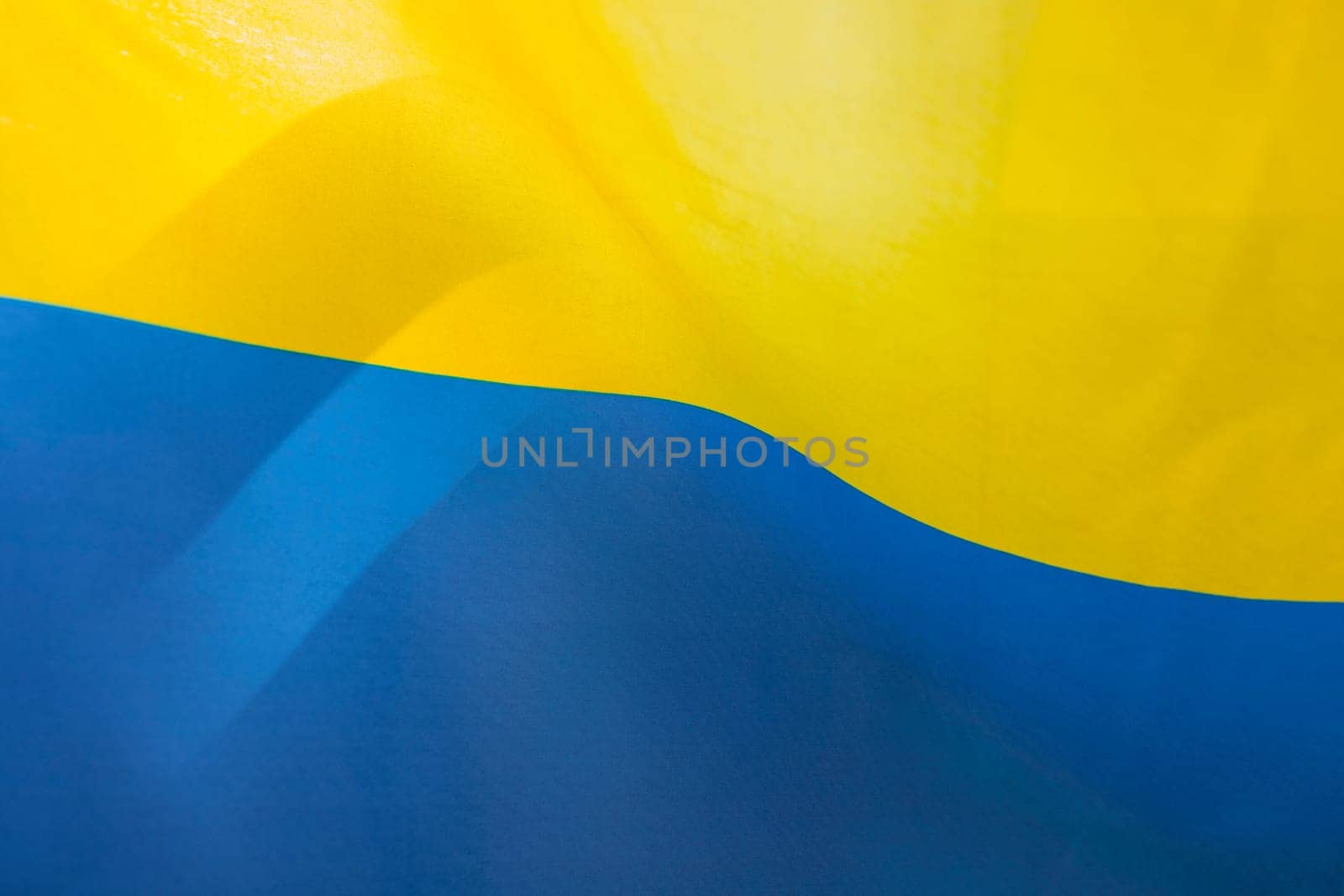 Flag of Ukraine, UA. Blue and yellow colors. Close up shot, background