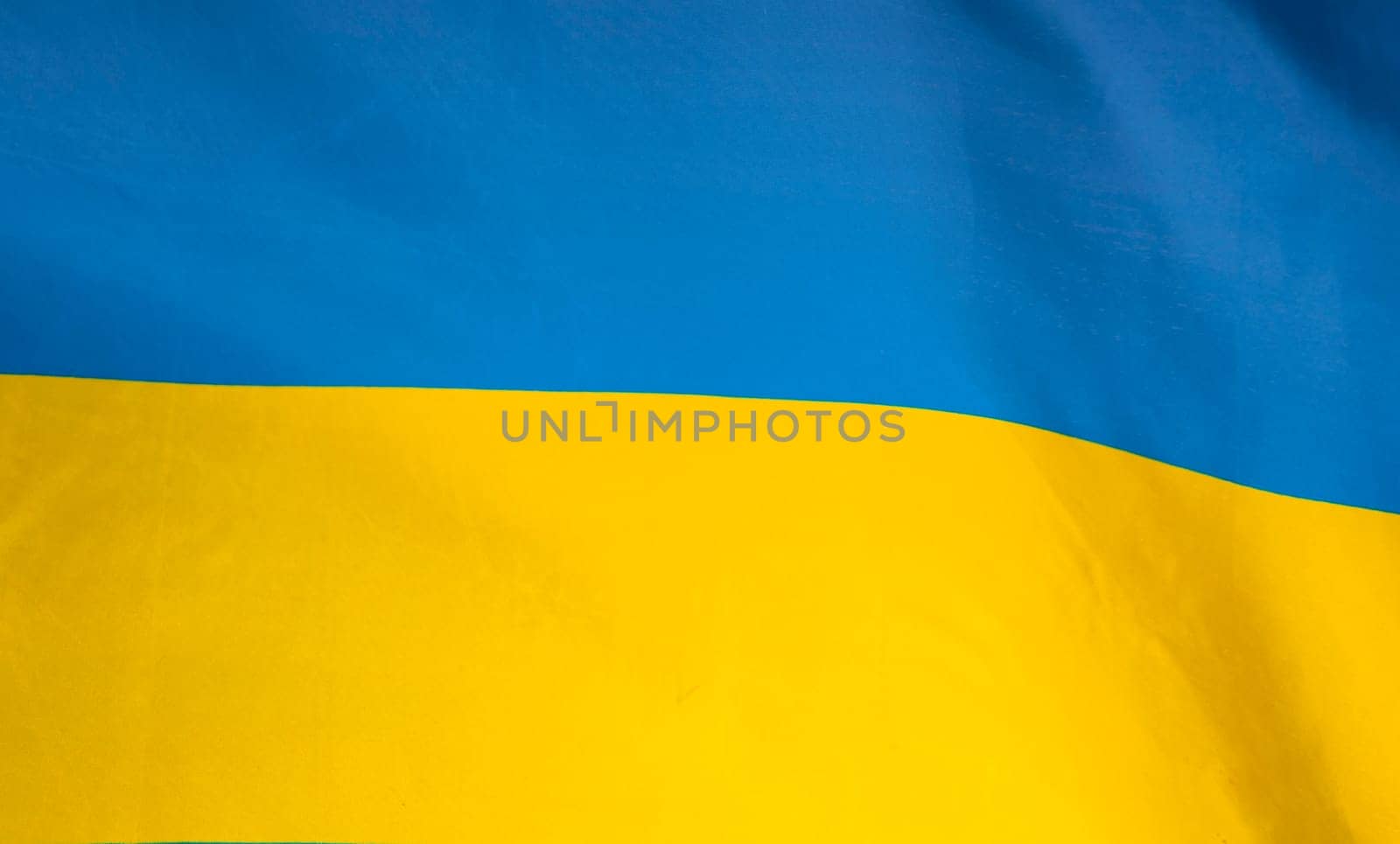 Flag of Ukraine. Blue and yellow colors. Close up shot, background