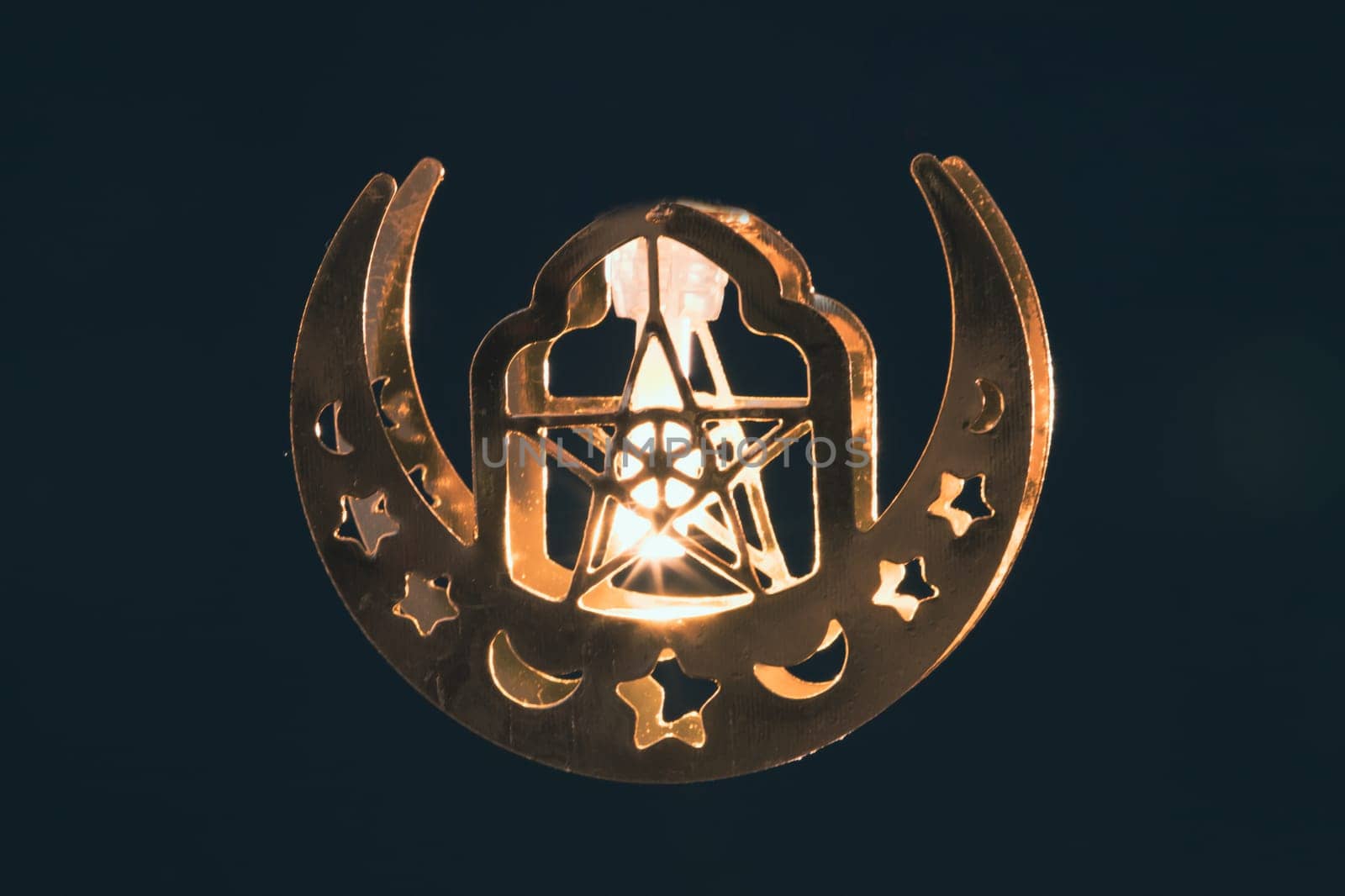 Ramadan Kareem background. Ornamental Arabic lantern glowing at night