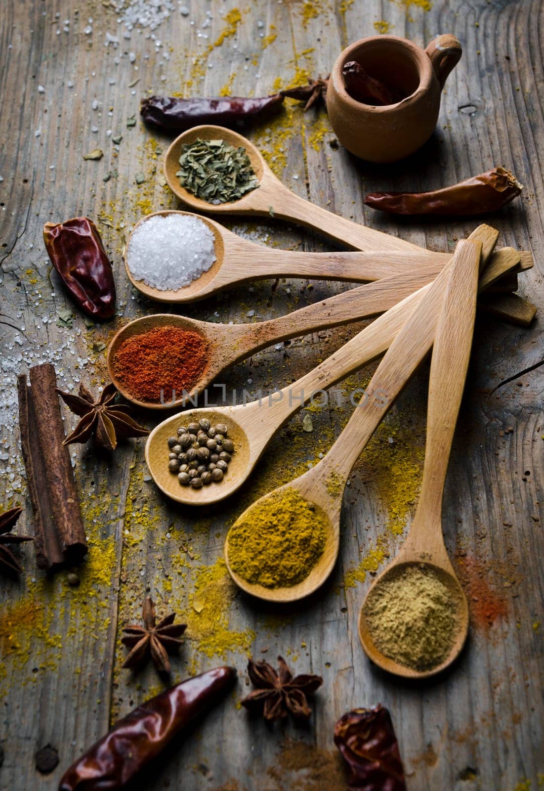 Colorful spices on rustic wooden table