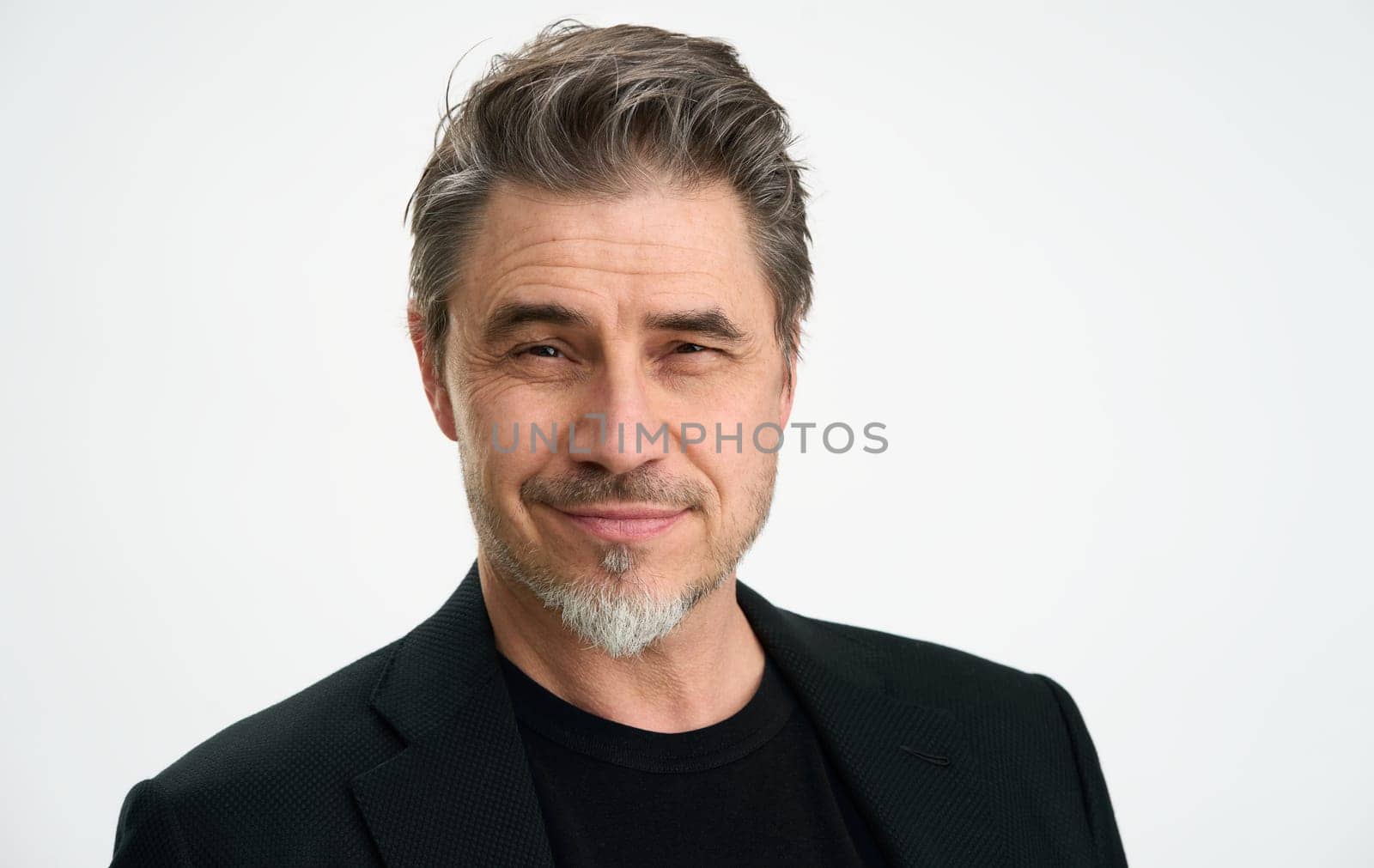 Middle age businessman in jacket. Mid adult, mature age man, happy smiling. Head shot portrait isolated on white.
