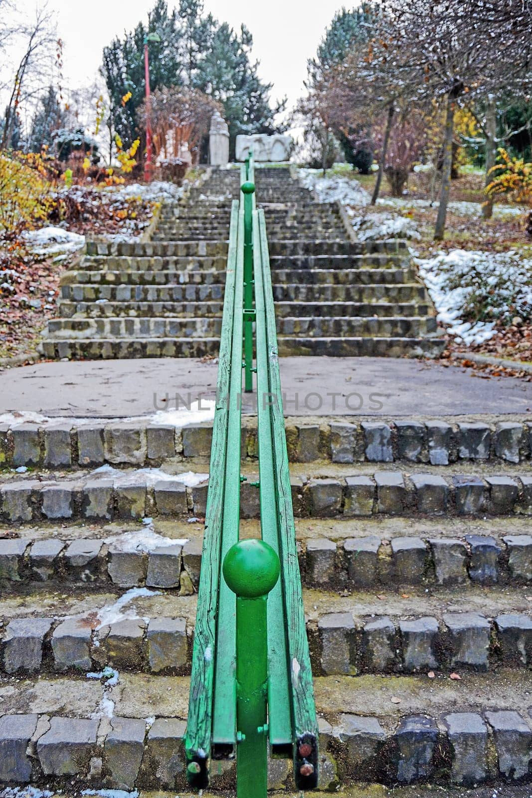 Park with stone stairs in winter