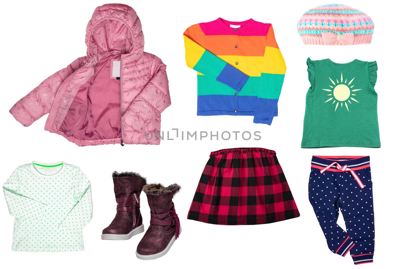 Collage set of little girl spring clothing isolated on a white background. The collection of a stylish pink down jacket, a sweater, a jeans skirt, boots, shirts and pants. Kids autumn and summer fashion.