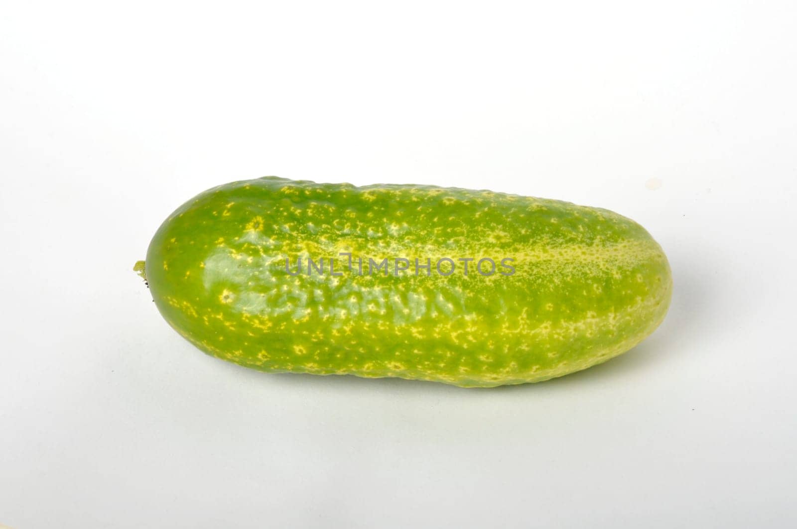 Small cucumber on a white background