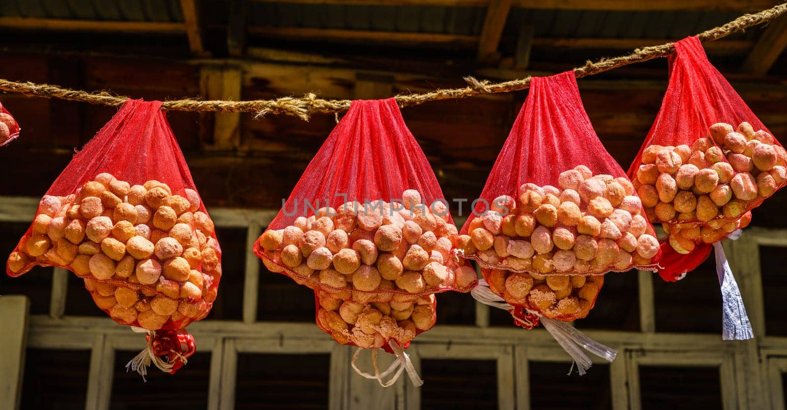 Qurut - a traditional Tajik dried cheese is curing in the sun at a small village in the mountains of Tajikistan