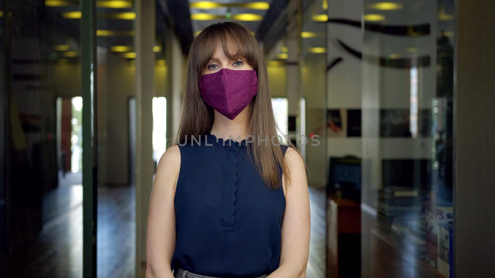 Covid-19 - businessman wearing face mask in empty office. Business in coronavirus quarantine times.