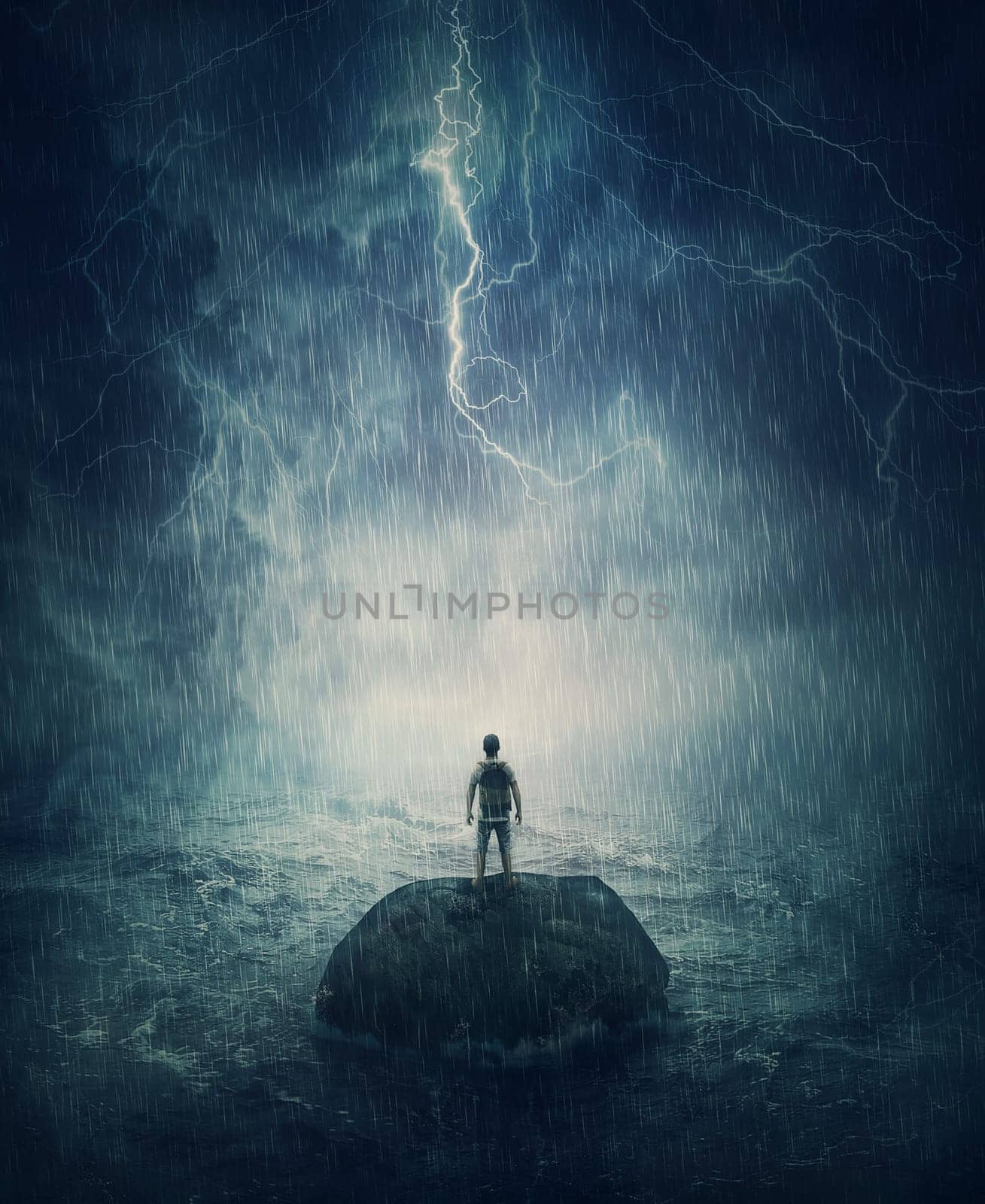 Alone man stands on a small rock island, lost in the middle of the ocean under the stormy night sky. Failure and despair concept, seeking for help. Life crisis, surviving a hopeless situation