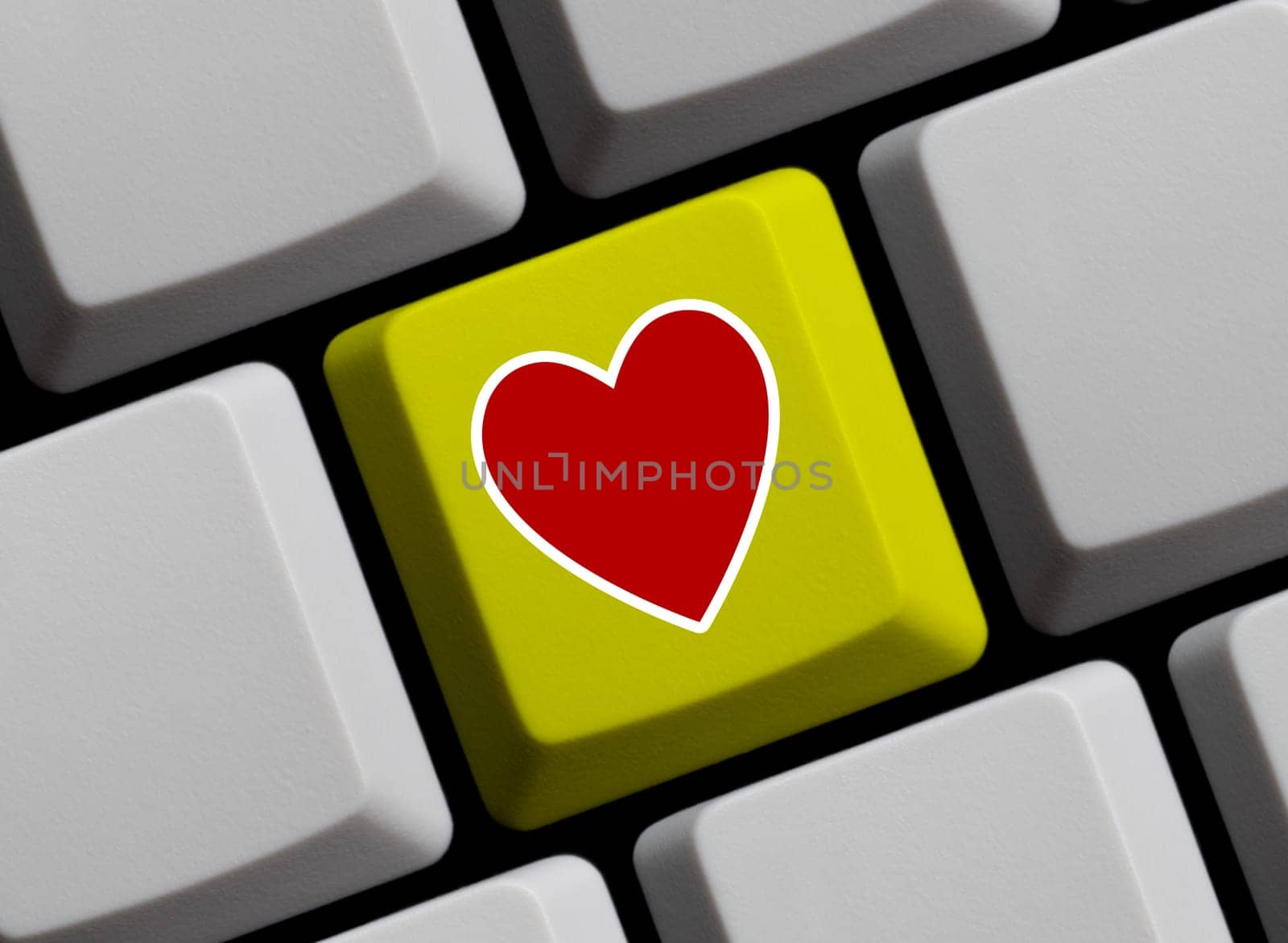 Red heart on yellow computer keyboard 3D illustration