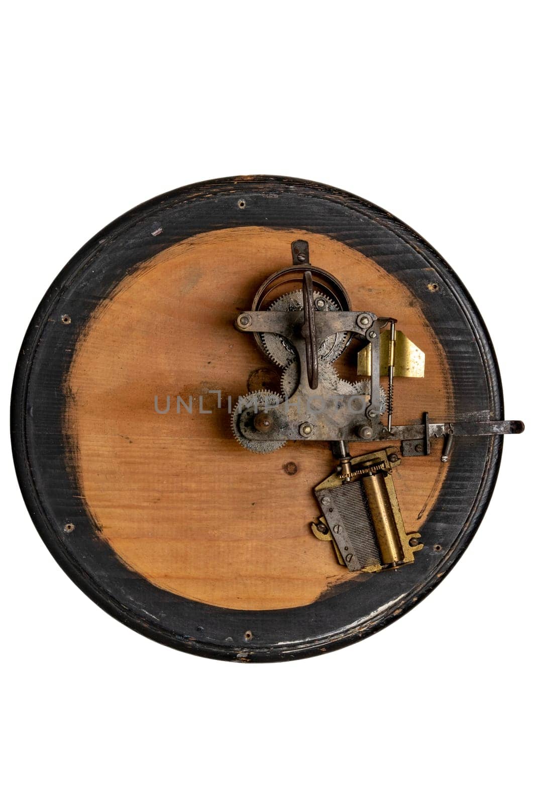Inside the antique revolving Christmas tree stand the mechanism for playing two Christmas carols consisting of roller mechanism with music box and spring drive. Clipping path.