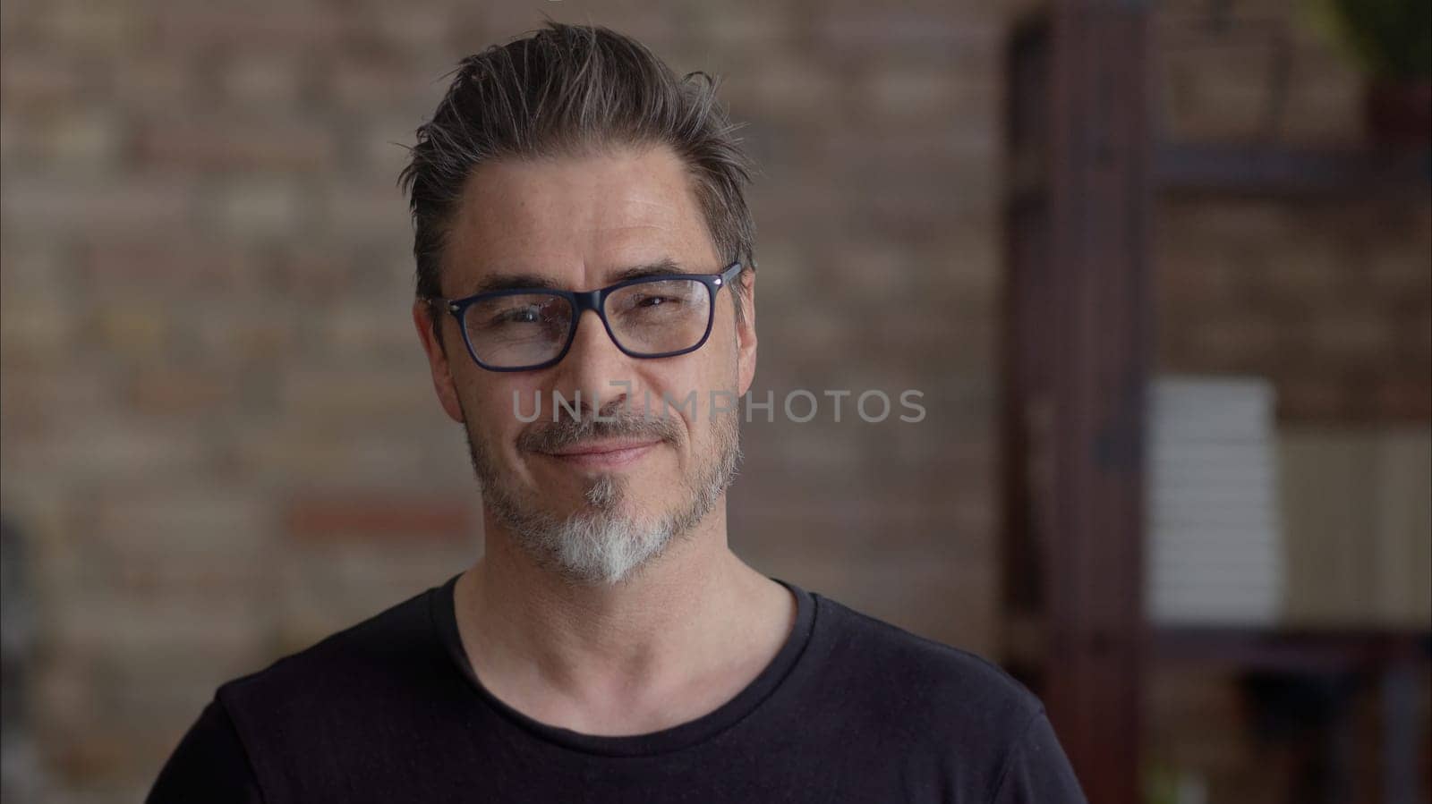 Portrait of mature age, middle age, mid adult man in 50s, happy confident smile. Copyspace.