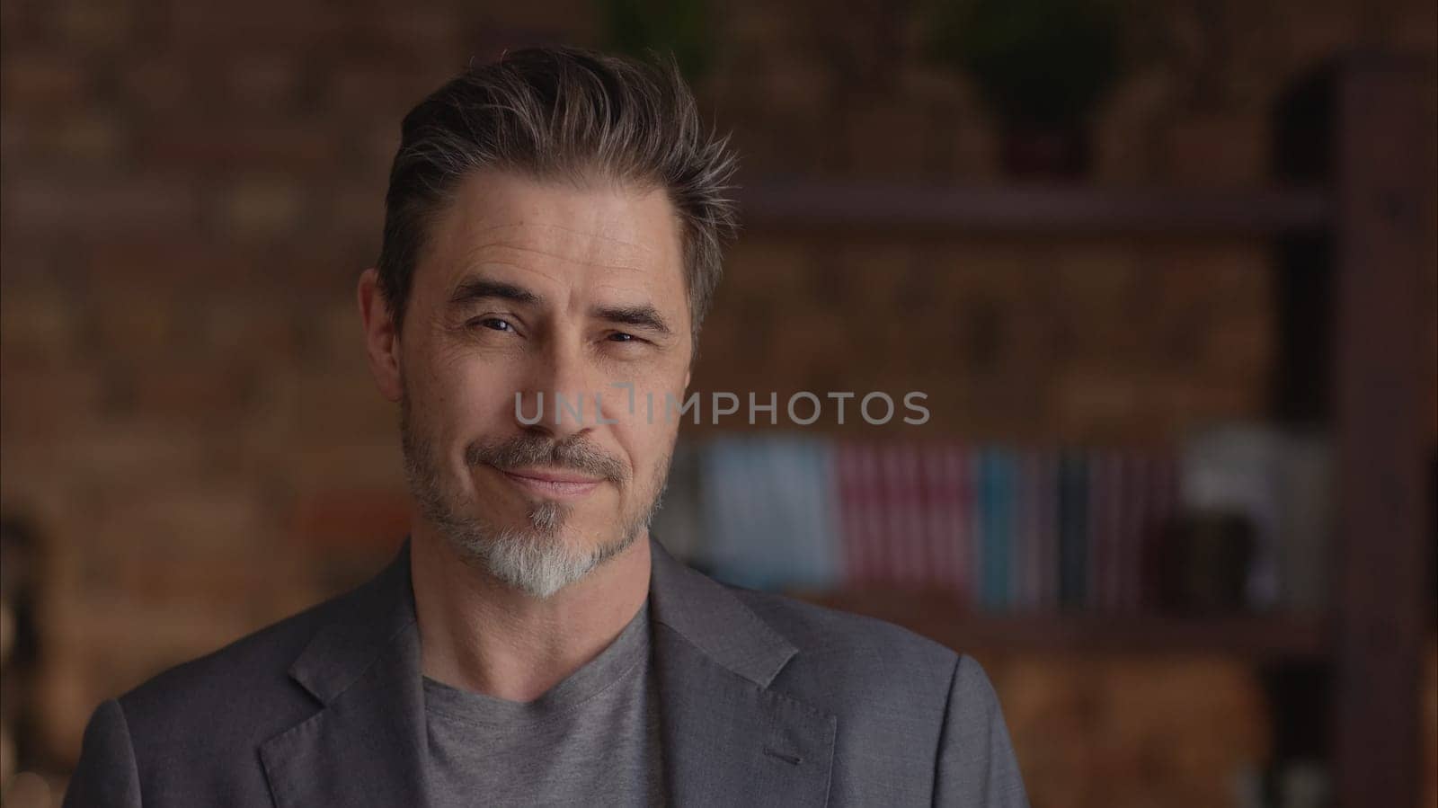 Confident businessman smiling. Portrait of mature age, middle age, mid adult man in 50s, happy confident smile. Copyspace.